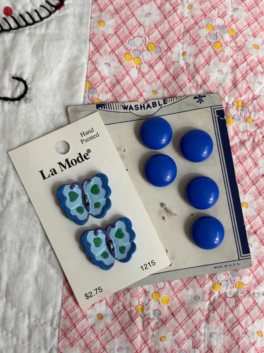 Vintage cards of blue plastic round top and butterfly buttons